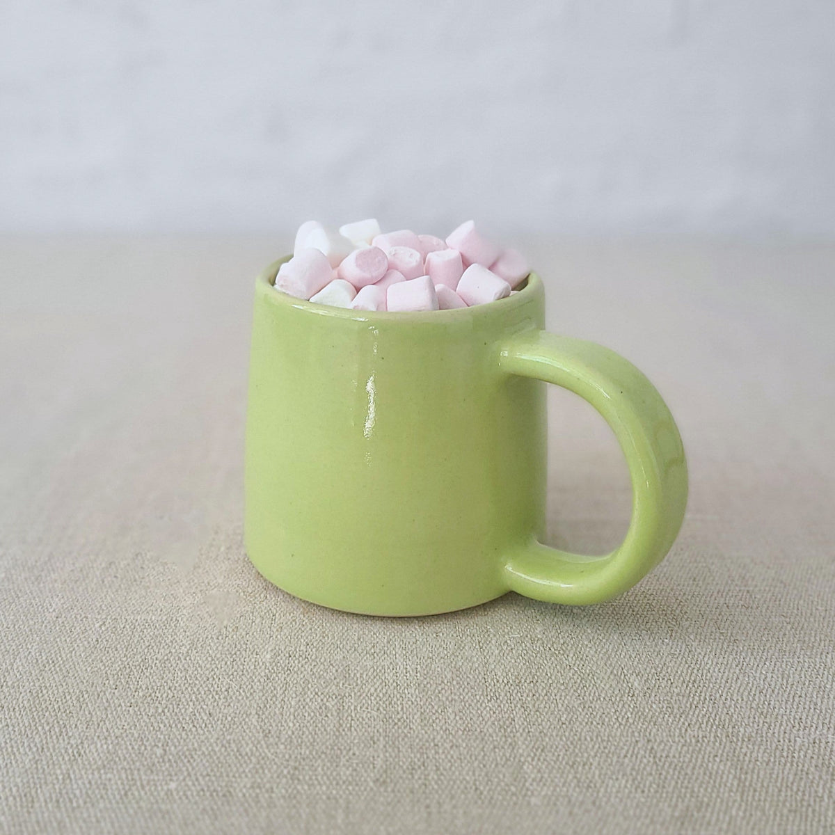 Spring green Katie L Thompson Designs standard mug with a smooth handle and vibrant color, displayed on a plain background.