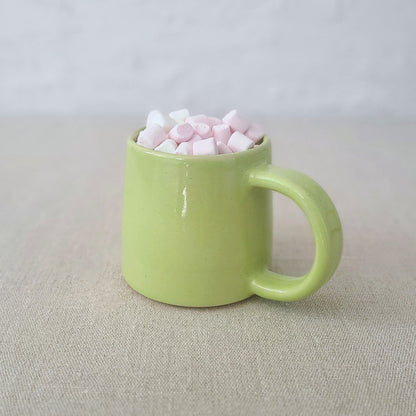 Spring green Katie L Thompson Designs standard mug with a smooth handle and vibrant color, displayed on a plain background.
