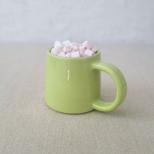 Spring green Katie L Thompson Designs standard mug with a smooth handle and vibrant color, displayed on a plain background.
