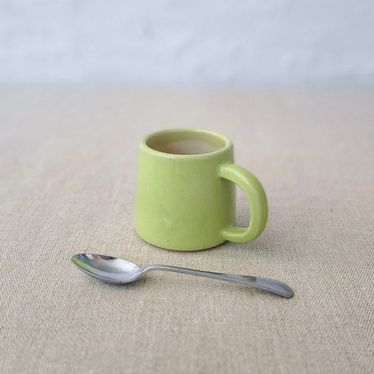 Spring green classic espresso mug by Katie L Thompson Designs, featuring a smooth ceramic surface and elegant shape.