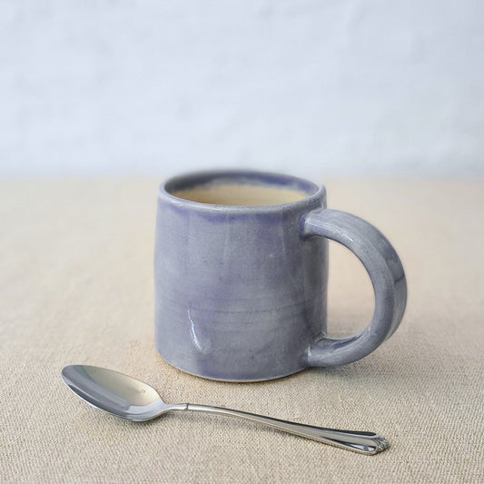 Amethyst purple classic standard mug with Katie L Thompson Designs branding, featuring a smooth ceramic surface and rounded handle.