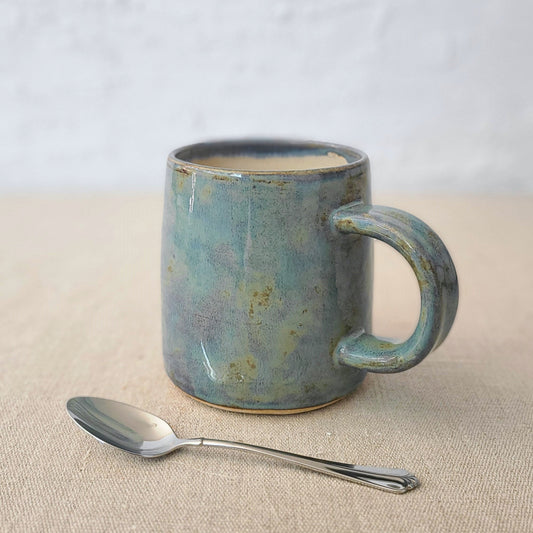 Seafoam blue ceramic pint mug by Katie L Thompson Designs, featuring a classic shape and smooth finish.