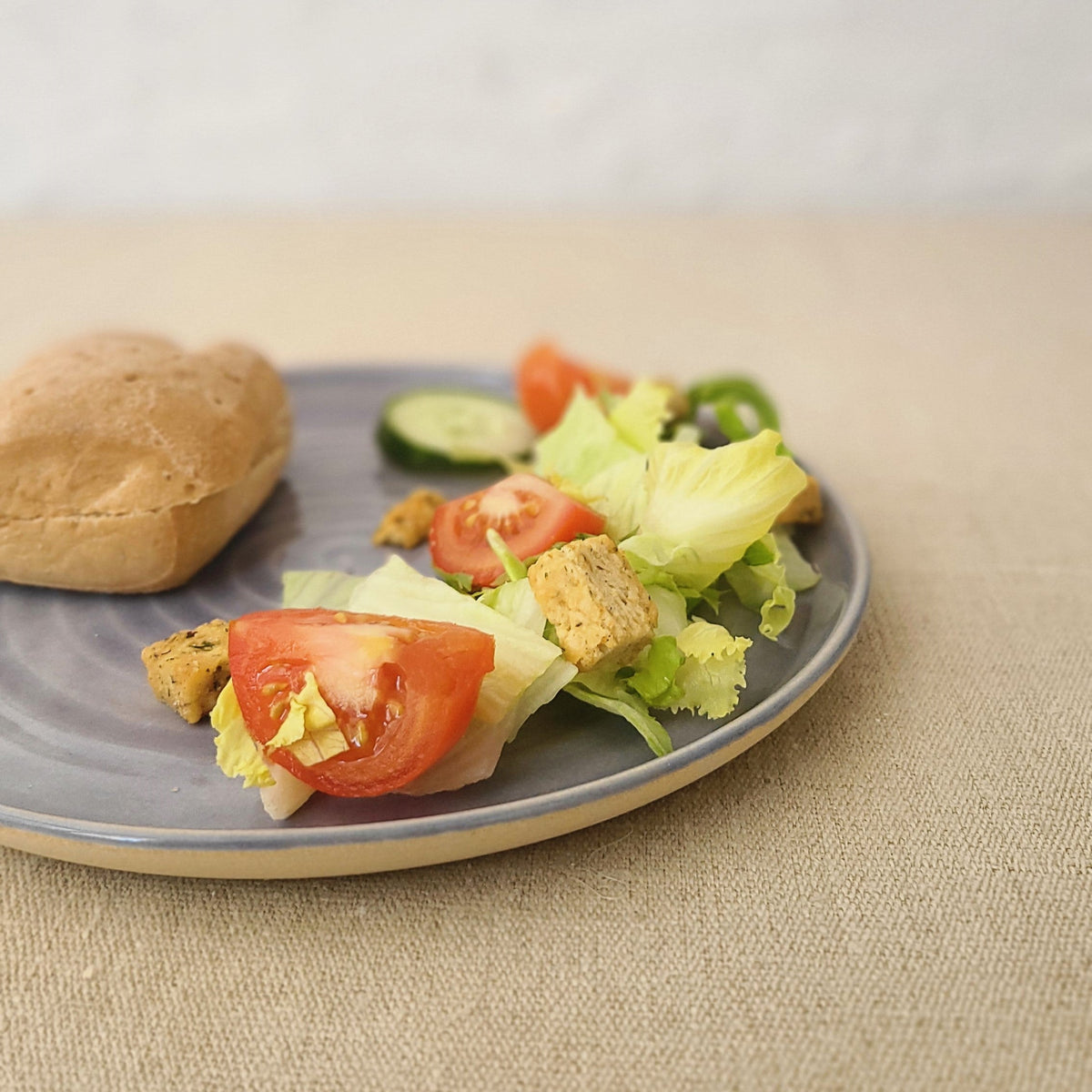 Amethyst purple ceramic lunch plate with a classic round design from Katie L Thompson Designs.