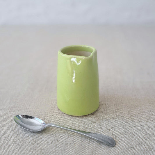 Spring green mini jug by Katie L Thompson Designs featuring a classic, small ceramic jug with a smooth, glossy finish.