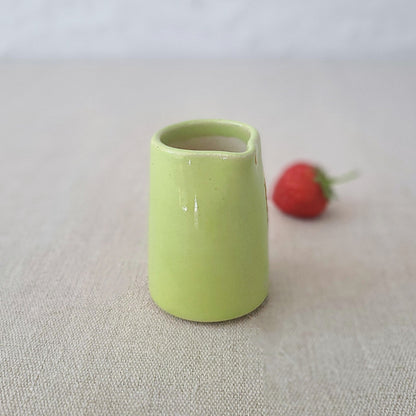 Spring green mini jug by Katie L Thompson Designs, ceramic mini jug with a classic shape and decorative handle.