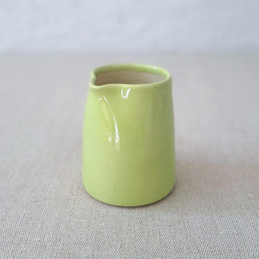 Spring green small ceramic jug by Katie L Thompson Designs, featuring a classic shape and smooth finish.