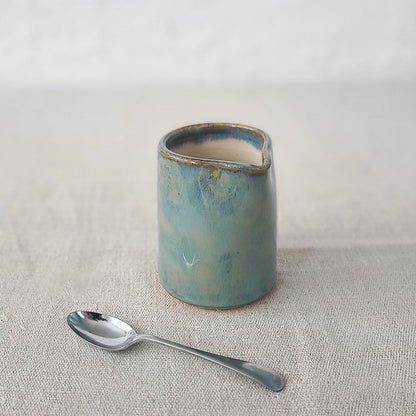 Seafoam blue small ceramic jug by Katie L Thompson Designs, featuring a classic shape and smooth finish.