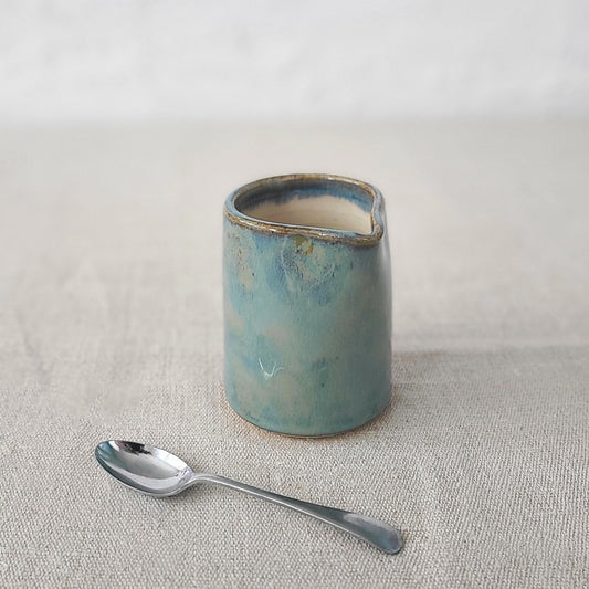 Seafoam blue small ceramic jug by Katie L Thompson Designs, featuring a classic shape and smooth finish.