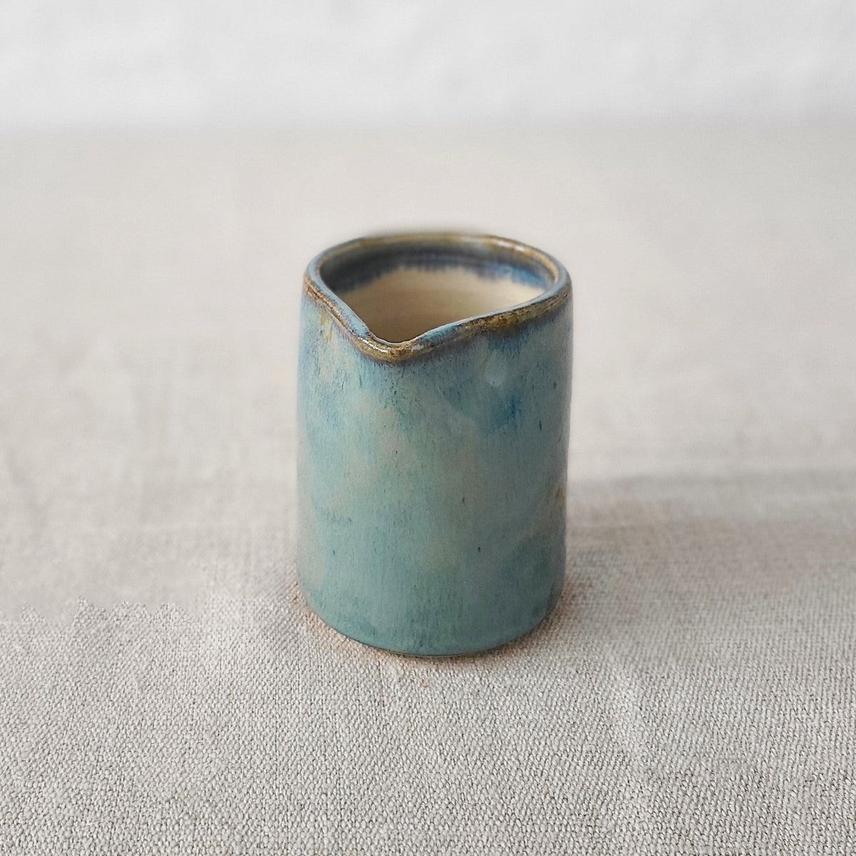 Seafoam blue small ceramic jug by Katie L Thompson Designs, featuring a classic shape and smooth finish.