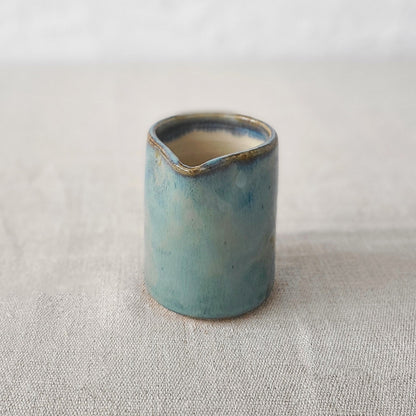 Seafoam blue small ceramic jug by Katie L Thompson Designs, featuring a classic shape and smooth finish.