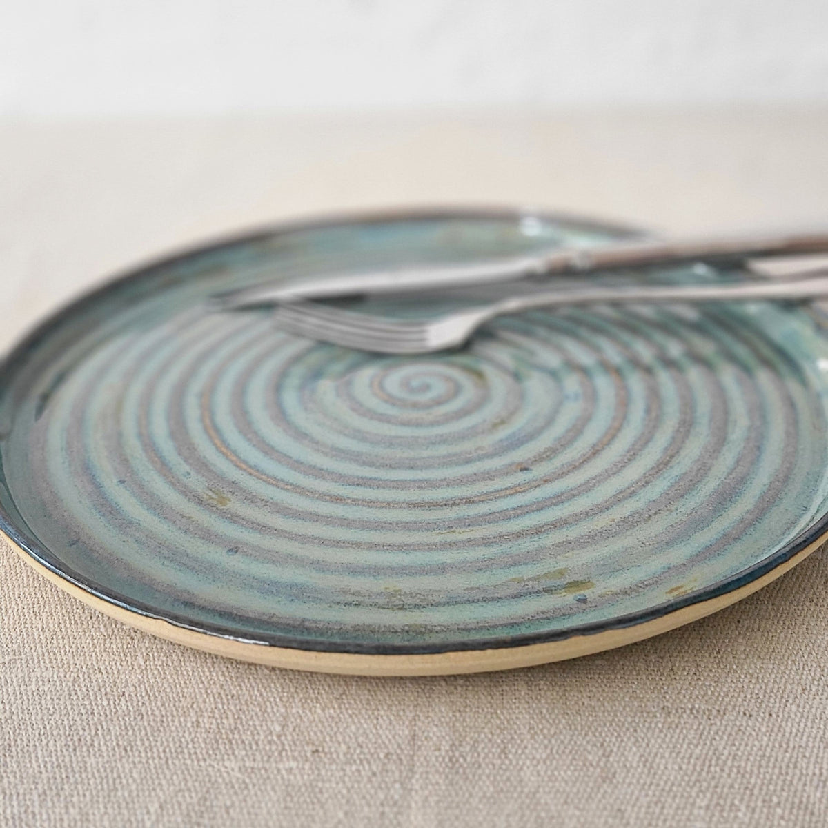 Seafoam blue ceramic dinner plate by Katie L Thompson Designs, classic round design with a smooth glossy finish.