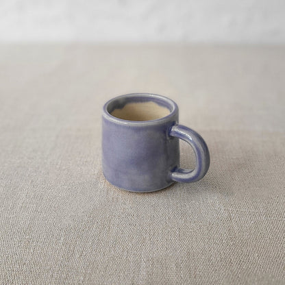 Amethyst purple ceramic espresso mug with classic design by Katie L Thompson Designs, shown from a side view with a smooth finish.