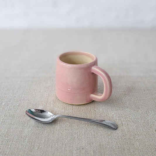 Blush pink classic espresso mug by Katie L Thompson Designs with a smooth ceramic finish and rounded handle.