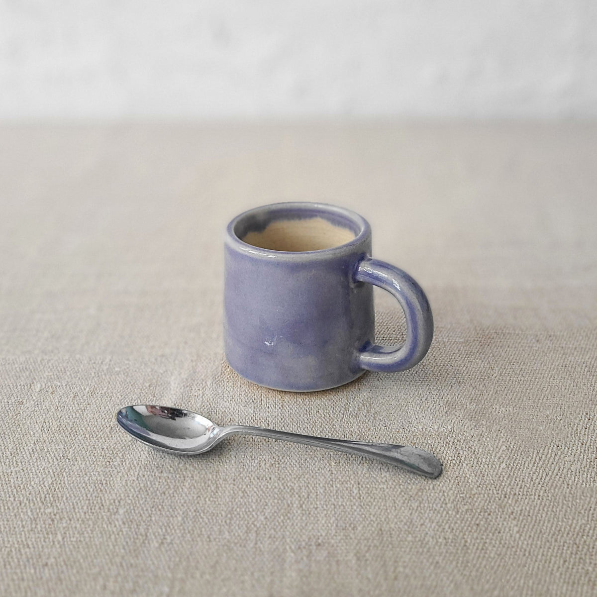 Amethyst purple classic espresso mug by Katie L Thompson Designs with a smooth ceramic finish and rounded handle.