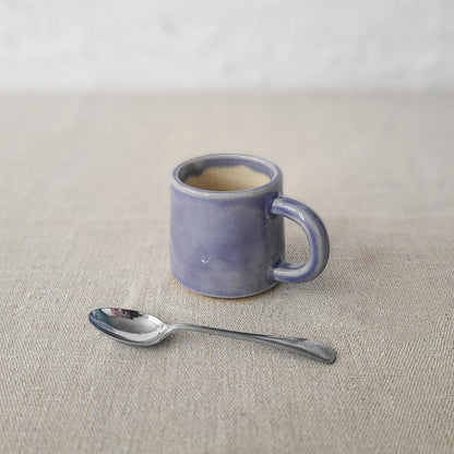 Amethyst purple classic espresso mug by Katie L Thompson Designs with a smooth ceramic finish and rounded handle.