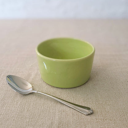 Spring green classic side bowl by Katie L Thompson Designs, featuring a smooth, round ceramic shape with a glossy finish.