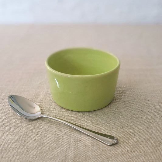 Spring green classic side bowl by Katie L Thompson Designs, featuring a smooth, round ceramic shape with a glossy finish.