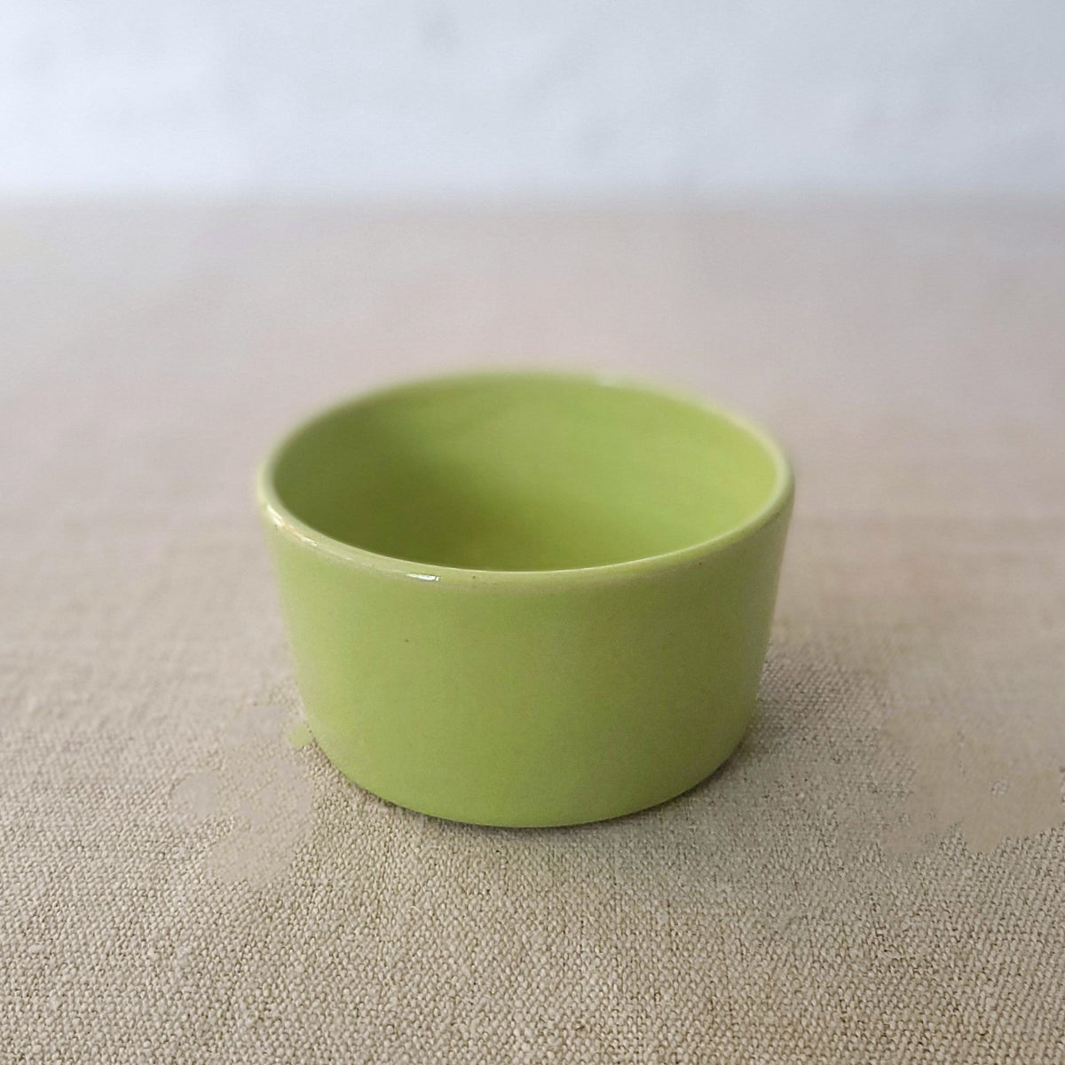 Spring green classic side bowl by Katie L Thompson Designs featuring a smooth, rounded ceramic design for serving small dishes.