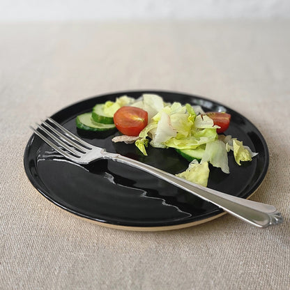 Jet black classic side plate by Katie L Thompson Designs, featuring a smooth round ceramic surface for serving small dishes.