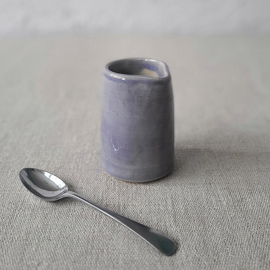 Amethyst purple mini jug by Katie L Thompson Designs, showcasing a small ceramic jug with a glossy purple finish.