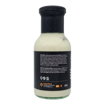 Bottle of FireFly Barbecue Alabama White BBQ Sauce with label visible, creamy white sauce in a squeeze bottle, ready for grilling.