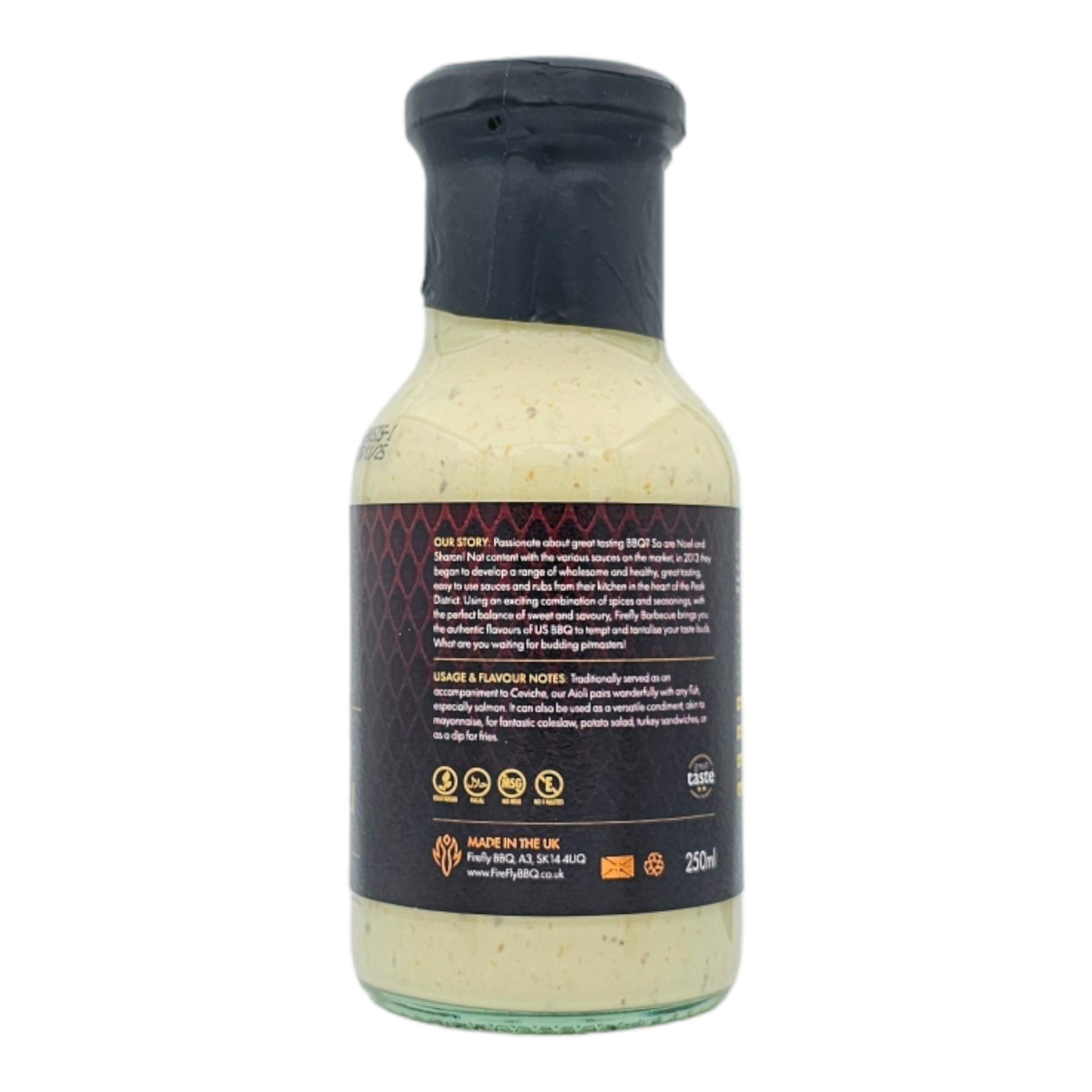Peruvian Amarillo Chilli Aioli from FireFly Barbecue, vibrant yellow sauce in a jar with fresh chili peppers and garlic.