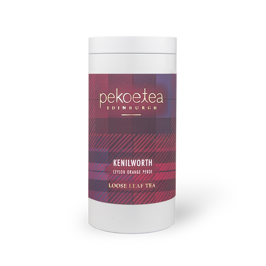 Kenilworth Ceylon Orange Pekoe tea in a decorative PekoeTea Edinburgh caddy with orange and gold accents.