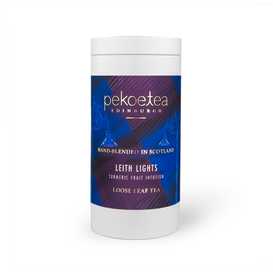 Leith Lights Turmeric Fruit Infusion tea in a PekoeTea Edinburgh caddy, featuring a vibrant tea blend with turmeric and fruit flavors.