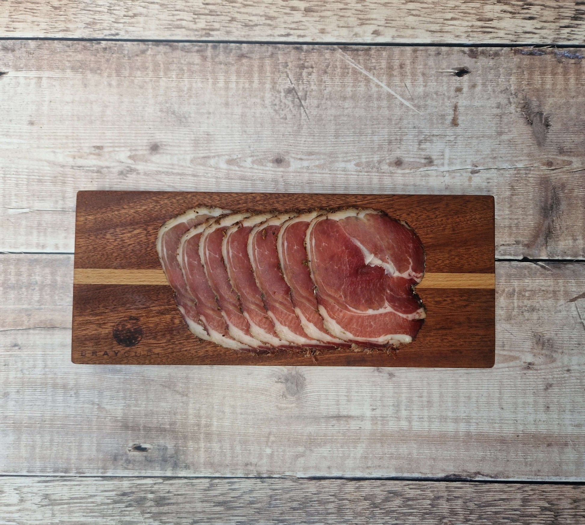 Air-dried ham gift card from Bray Cured for charcuterie experiences, featuring a boxed presentation and a sleek design.