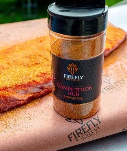 FireFly Barbecue Competition BBQ Rub in a jar, showing the spice blend with a focus on the textured seasoning and label.