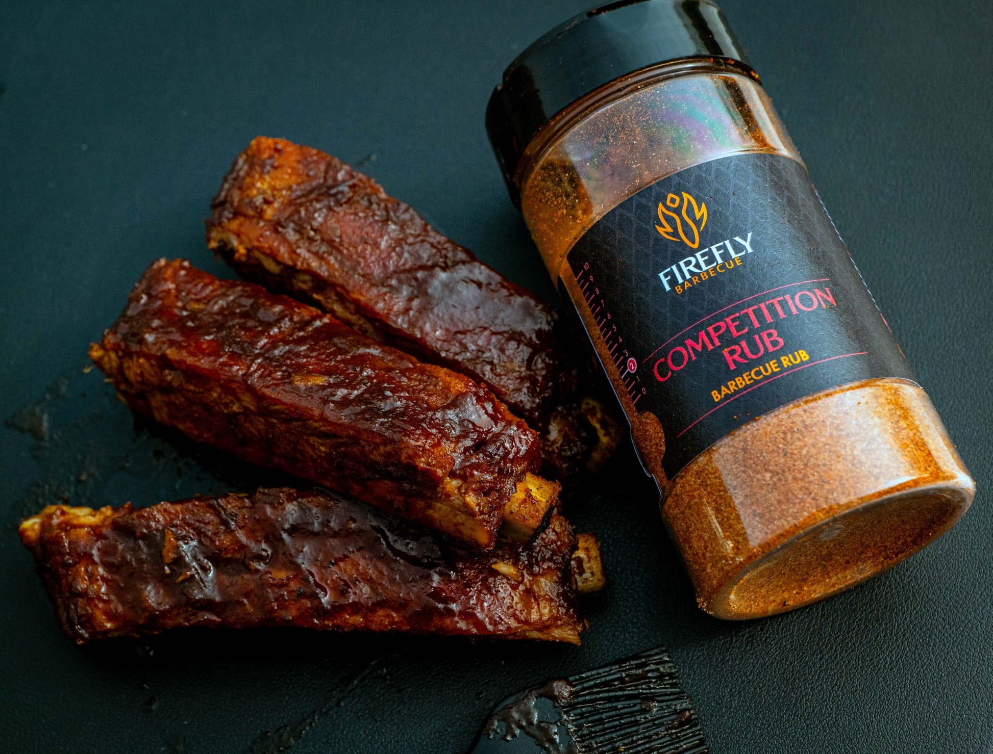 FireFly Barbecue Competition BBQ Rub jar with a label, showcasing a flavorful spice blend for grilling and smoking meats.
