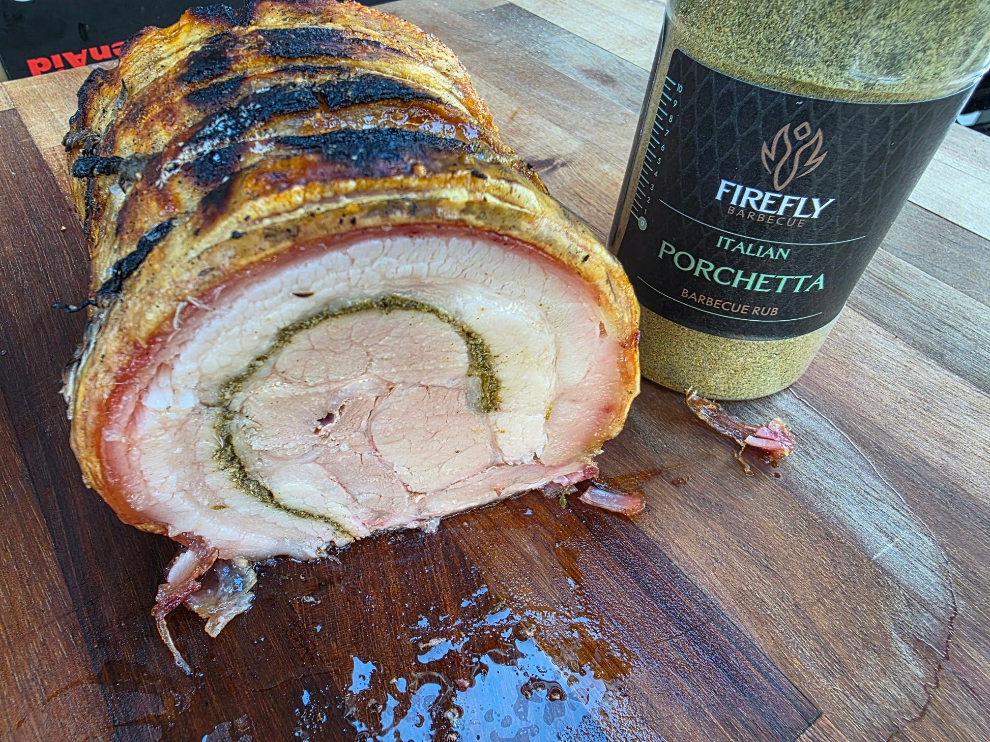 Italian Porchetta Rub BBQ seasoning by FireFly Barbecue, showing a jar of flavorful spice blend for grilling and roasting.