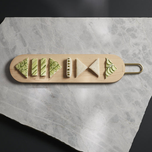 Heath maple wood serving board by Aaron Probyn with a smooth surface and natural wood grain for elegant serving.