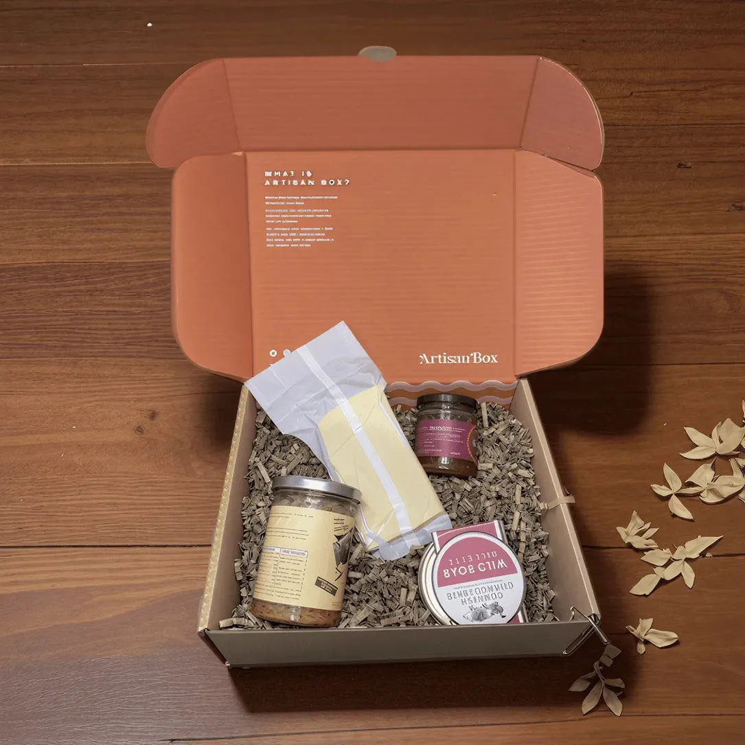 ArtisanBox Discovery Club subscription box with curated artisan products displayed in a colorful open box.