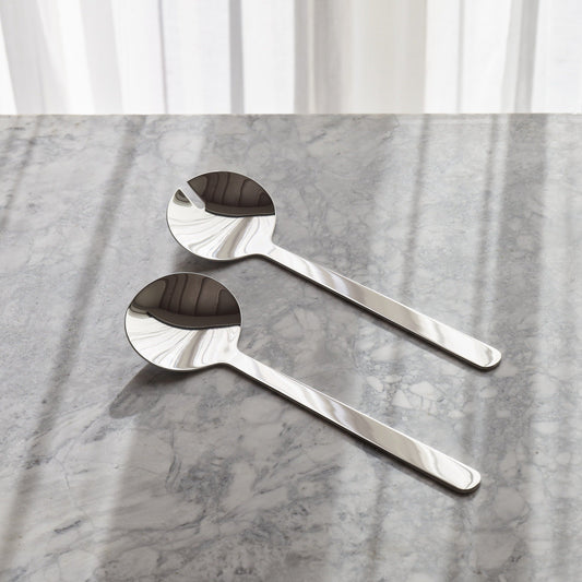 Aaron Probyn Borough salad servers set with polished stainless steel handles and fork and spoon tips for serving salads.