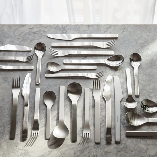 Aaron Probyn FLINT cutlery set with sleek flatware design, featuring fork, knife, and spoon arranged on a neutral background.