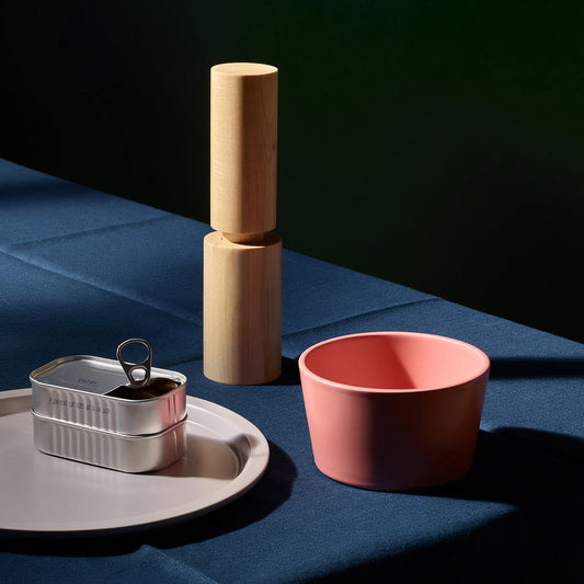 Set of two Aaron Probyn NEU cereal bowls with colorful, modern design, shown stacked with bright patterns on white ceramic.
