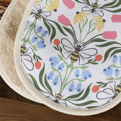 Close-up of Avalon Home UK British Bees oven gloves showing detailed bee pattern and heat-resistant fabric.
