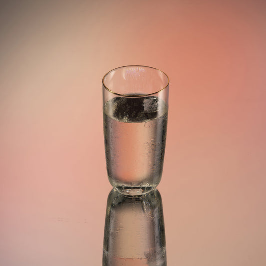 Set of two Aaron Probyn COVE highball glasses featuring clear glass and sleek, modern design.