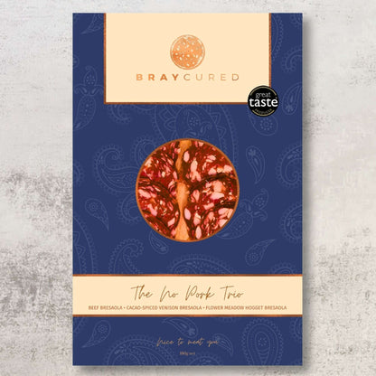 Bray Cured No Pork Tasting Trio featuring a selection of pork-free charcuterie slices and cured meats on a wooden board.