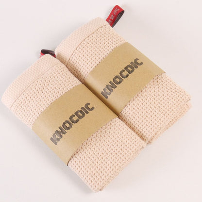 Two KNOCDIC® premium coffee cloths, 34x34 cm, made for baristas, featuring soft cotton material on a clean surface.