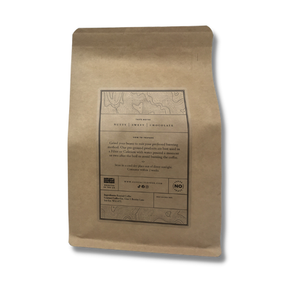 Single Origin Brazil Daterra coffee from Contact Coffee Company Ltd., showing fresh roasted coffee beans in a clear bag.