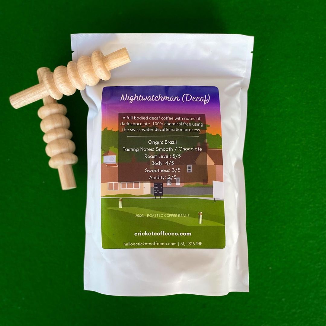 Decaf coffee bag from Nightwatchman by Clubhouse Roastery, featuring dark roasted beans in a resealable bag.