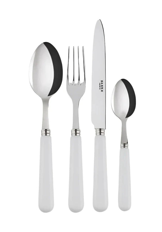 Four-piece Casa by Josephine Jenno white pop unis cutlery set with forks, knives, and spoons on a neutral background.