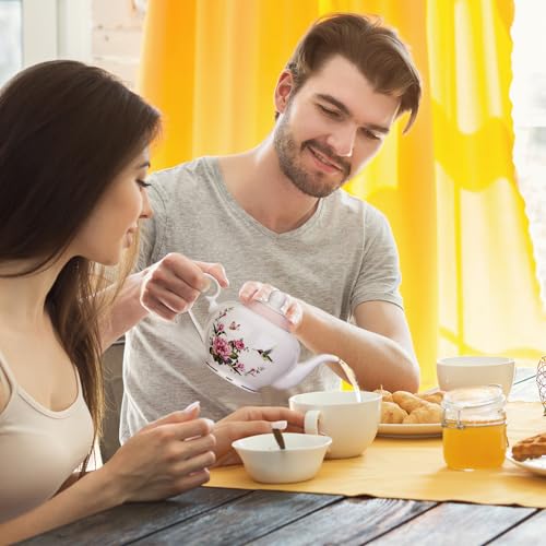 London Boutique pink teapot with floral butterfly design, 700ml capacity, infuser for loose tea, easy handle, perfect for 2 cups.