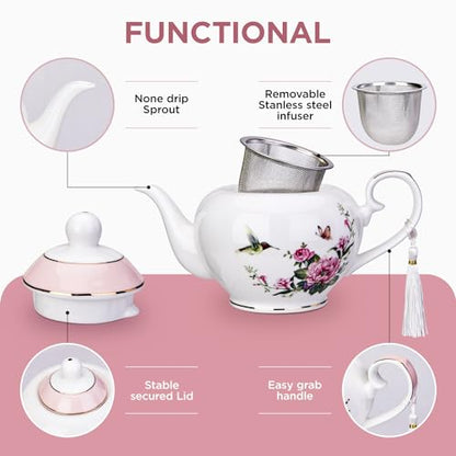 Pink London Boutique teapot with floral bird and butterfly design, 700ml capacity, infuser for loose tea, easy grab handle.