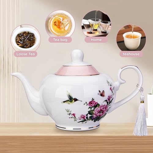 London Boutique pink ceramic teapot with butterfly and bird design, 700ml capacity, easy handle, includes infuser for loose tea.