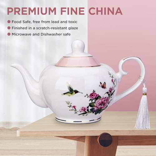 London Boutique Lifestyle pink teapot with butterfly and bird design, 700ml capacity, easy-grab handle, perfect for loose tea brewing.
