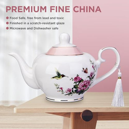 London Boutique Lifestyle pink teapot with butterfly and bird design, 700ml capacity, easy-grab handle, perfect for loose tea brewing.