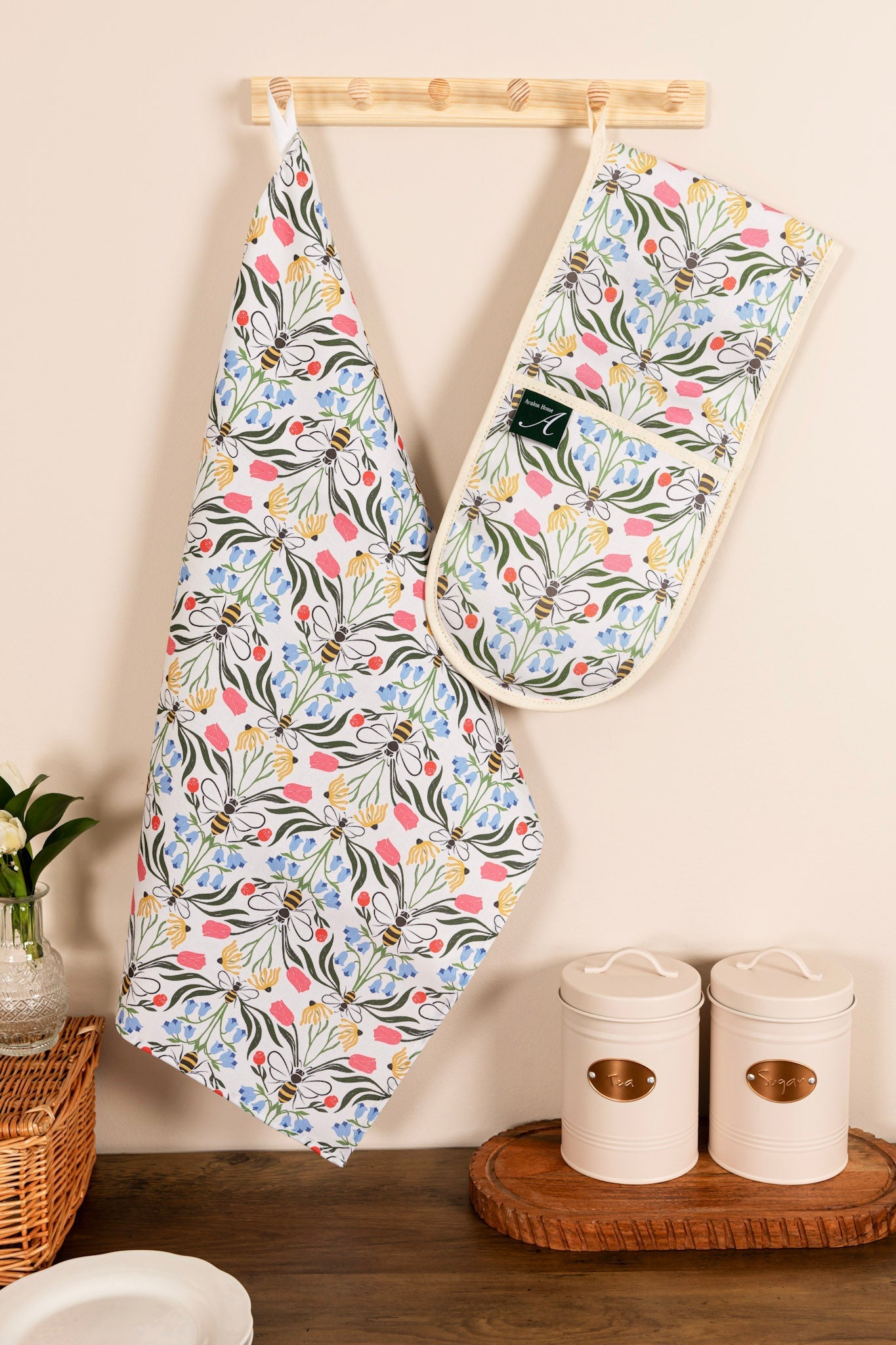 Avalon Home UK British Bees oven gloves with bee and floral design, heat-resistant fabric, hanging loop for kitchen use.